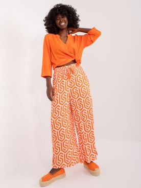 Oranžovo-biele voľné vzorované nohavice SUBLEVEL