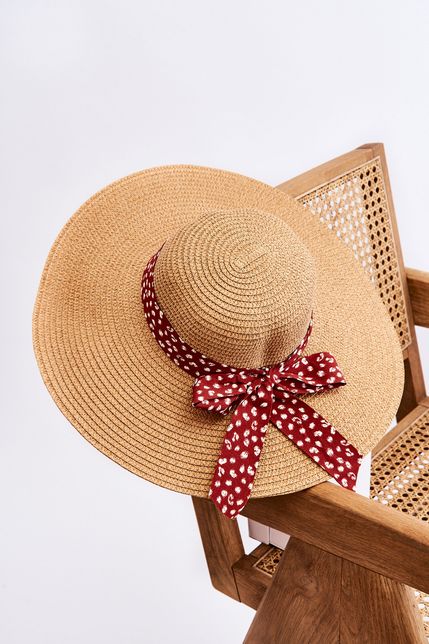 Béžový dámsky módny klobúk s červeno-bielou mašľou