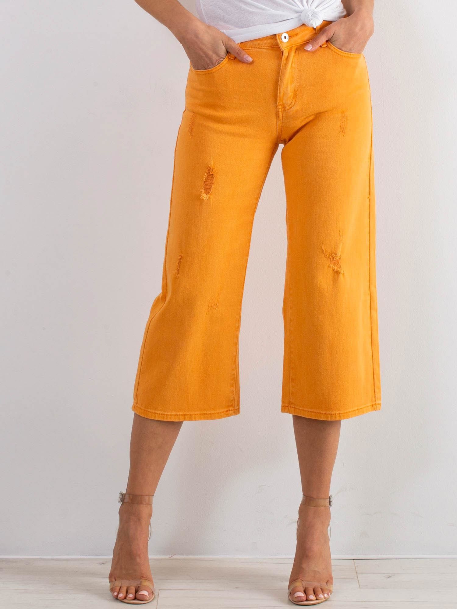 Oranžové capri rozšírené džínsy